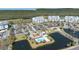 Aerial view of the resort with multiple condo buildings, waterways, and amenities at 2333 Feather Sound Dr # A308, Clearwater, FL 33762