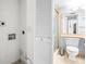 Bathroom featuring a toilet, vanity, and shower at 2333 Feather Sound Dr # A308, Clearwater, FL 33762