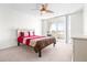 Cozy bedroom with a ceiling fan and sliding glass doors that lead to a balcony at 2333 Feather Sound Dr # A308, Clearwater, FL 33762