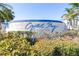 Crystal Bay Alafia River Sound neighborhood entrance sign with manicured landscaping and palm trees at 2333 Feather Sound Dr # A308, Clearwater, FL 33762