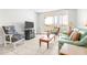Comfortable living room with a balcony, tile floors, and ample seating at 2333 Feather Sound Dr # A308, Clearwater, FL 33762