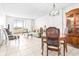 Inviting living room with a large balcony, dining area, and tile flooring at 2333 Feather Sound Dr # A308, Clearwater, FL 33762