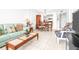 Well-lit living room open to the dining area, offering a relaxed and inviting space at 2333 Feather Sound Dr # A308, Clearwater, FL 33762