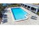 An aerial view of the pristine swimming pool with lounge chairs, inviting waters, and clear depths at 2333 Feather Sound Dr # A308, Clearwater, FL 33762