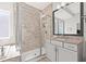 Elegant bathroom boasting a glass shower enclosure, granite counters, and custom vanity at 307 S Gomez Ave # 2, Tampa, FL 33609