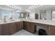 Spacious bathroom with double vanity, a large mirror, and a separate makeup area at 3107 Mountain Spruce Ter, Wesley Chapel, FL 33543