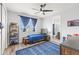 Bright bedroom featuring a ceiling fan, blue accents, and plenty of room for activities at 3107 Mountain Spruce Ter, Wesley Chapel, FL 33543