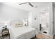Bedroom featuring white bed, ceiling fan, and bathroom ensuite at 3107 Mountain Spruce Ter, Wesley Chapel, FL 33543