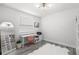Modern bedroom setup with a sleek desk, stylish chair, and a decorative mirror at 3107 Mountain Spruce Ter, Wesley Chapel, FL 33543