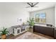 Bright and airy home office featuring hardwood floors, large windows, and elegant decor at 3107 Mountain Spruce Ter, Wesley Chapel, FL 33543