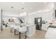 Open concept kitchen with a large island, stainless steel appliances, and seamless flow into the living area at 3107 Mountain Spruce Ter, Wesley Chapel, FL 33543