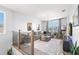 Spacious upstairs loft with comfortable gray sectional, stylish decor, and plenty of natural light at 3107 Mountain Spruce Ter, Wesley Chapel, FL 33543