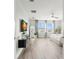 Bright and airy main bedroom with modern decor, large windows, and sleek hardwood floors at 3107 Mountain Spruce Ter, Wesley Chapel, FL 33543