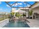 Swim up to the fire pit in your screened-in pool that overlooks the lake at 3107 Mountain Spruce Ter, Wesley Chapel, FL 33543
