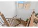 Bright staircase with wood treads and black metal railings, illuminated by a nearby window at 3107 Mountain Spruce Ter, Wesley Chapel, FL 33543