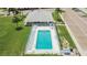 Aerial view of a pool surrounded by chairs and greenery at 313 Martha Ln # 4, Oldsmar, FL 34677