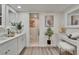 Elegant bathroom featuring double vanity sinks, marble floors, and modern fixtures at 313 Martha Ln # 4, Oldsmar, FL 34677