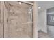 Modern bathroom featuring a glass shower with marble tile and sleek fixtures at 313 Martha Ln # 4, Oldsmar, FL 34677