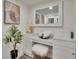 Bathroom vanity area with stylish decor, a plush stool, and ample counter space at 313 Martha Ln # 4, Oldsmar, FL 34677