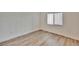 Bedroom features luxury vinyl plank flooring and window at 313 Martha Ln # 4, Oldsmar, FL 34677