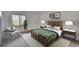 Cozy bedroom featuring a tropical leaf bedding set and an accent chair at 313 Martha Ln # 4, Oldsmar, FL 34677