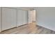 Bedroom boasts luxury vinyl plank flooring, double closet and access to other rooms at 313 Martha Ln # 4, Oldsmar, FL 34677