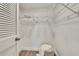 The closet features a wire rack and shelf along with a furry stool at 313 Martha Ln # 4, Oldsmar, FL 34677