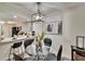Cozy dining room area with modern light fixture, table, and views to the kitchen at 313 Martha Ln # 4, Oldsmar, FL 34677