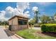 Charming guard house with stone accents and well-maintained landscaping at 313 Martha Ln # 4, Oldsmar, FL 34677