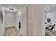 Bright hallway leading to a dining area and kitchen, creating an open and inviting space at 313 Martha Ln # 4, Oldsmar, FL 34677