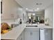 Bright kitchen features stainless steel appliances, and white cabinets and countertops at 313 Martha Ln # 4, Oldsmar, FL 34677