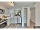 Bright kitchen features stainless steel appliances, and white cabinets and countertops at 313 Martha Ln # 4, Oldsmar, FL 34677