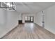 Bright living room featuring wood-look flooring, fireplace and sliding door access to outside at 313 Martha Ln # 4, Oldsmar, FL 34677