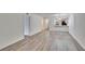 Bright living room with wood floors and a kitchen view at 313 Martha Ln # 4, Oldsmar, FL 34677