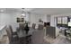Bright, open-concept dining and living room features modern decor and wood-look floors at 313 Martha Ln # 4, Oldsmar, FL 34677
