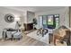 Living room with a fireplace and access to the patio at 313 Martha Ln # 4, Oldsmar, FL 34677