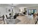 Open living space with the dining room, living room, and fireplace at 313 Martha Ln # 4, Oldsmar, FL 34677
