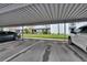 Designated parking spaces under metal carport offer shaded parking at 313 Martha Ln # 4, Oldsmar, FL 34677