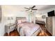 Bedroom with a large bed, nightstand, and mirror closet at 3456 Hunters Run Ln, Tampa, FL 33614