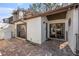 Charming exterior view of a home with a brick patio, stucco walls, and a well-maintained roof at 3456 Hunters Run Ln, Tampa, FL 33614