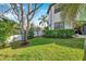 Beautiful backyard features a lush lawn, privacy fence, and mature landscaping at 3598 10Th Ne St, St Petersburg, FL 33704