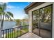 Exterior balcony overlooks the water with black metal railings and sliding glass doors at 3598 10Th Ne St, St Petersburg, FL 33704