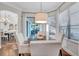Inviting breakfast nook with water views, hardwood floors, and comfortable seating ideal for casual dining at 3598 10Th Ne St, St Petersburg, FL 33704