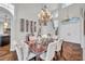 Sophisticated dining room features hardwood floors, chandelier, wine storage, and staircase leading to the upper level at 3598 10Th Ne St, St Petersburg, FL 33704