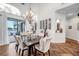 Elegant dining area features wood floors, large windows with water views, chandelier, and wine racks for sophisticated living at 3598 10Th Ne St, St Petersburg, FL 33704