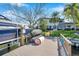 Waterfront property featuring a private dock, boat lift, and backyard at 3598 10Th Ne St, St Petersburg, FL 33704