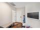 Hallway featuring wood floors, a bench, and convenient storage solutions at 3598 10Th Ne St, St Petersburg, FL 33704