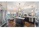 Bright kitchen with modern appliances, island, pendant lighting, and stunning water views at 3598 10Th Ne St, St Petersburg, FL 33704