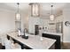 Bright and modern kitchen with marble countertops, stainless steel appliances, and pendant lighting at 3598 10Th Ne St, St Petersburg, FL 33704