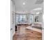 Large main bedroom offers a sitting area, hardwood floors and a decorative ceiling at 3598 10Th Ne St, St Petersburg, FL 33704